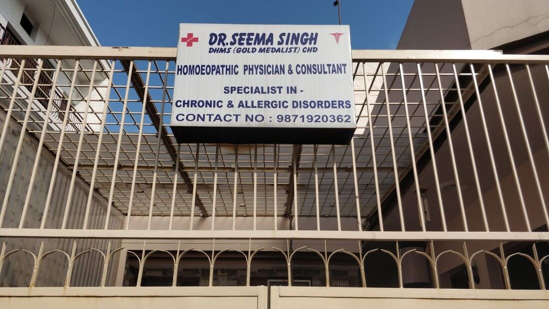 The clinic signboard: Dr. Seema Singh, DHMS (Gold Medalist) Chandigarh, Homoeopathic Physician and Consultant, specialist in chronic and allergic disorders.